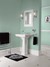 Pedestal sink in green bathroom