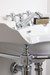 Traditional sink with chrome washstand